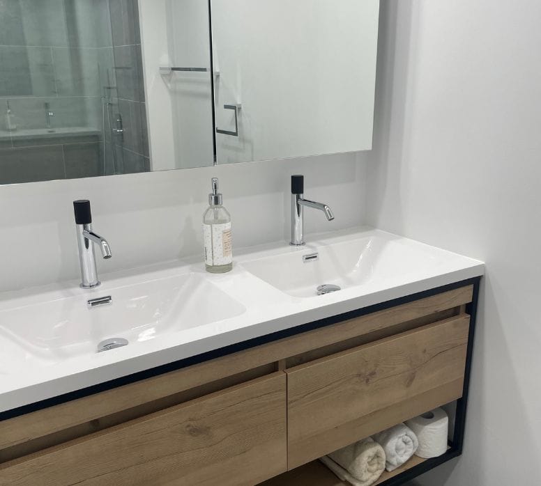 Double-sink floating vanity installed in a renovated bathroom